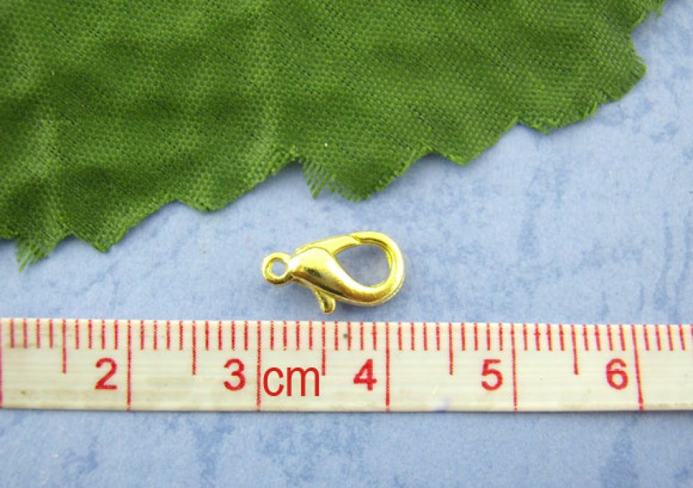 20 mosquetões 12 x 07 mm Ouro.