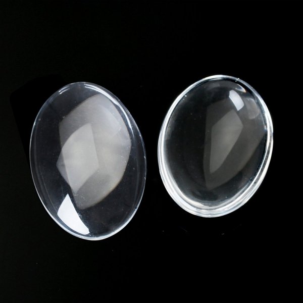 Caboch&atilde;o oval 15 x 20 mm em vidro transparente rebarbado N&deg;18 por 2 pe&ccedil;as
