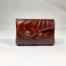 Bolsa retro-moedas feita de pele de vaca estampada.