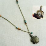 Tartaruga pendente longa com pérolas 