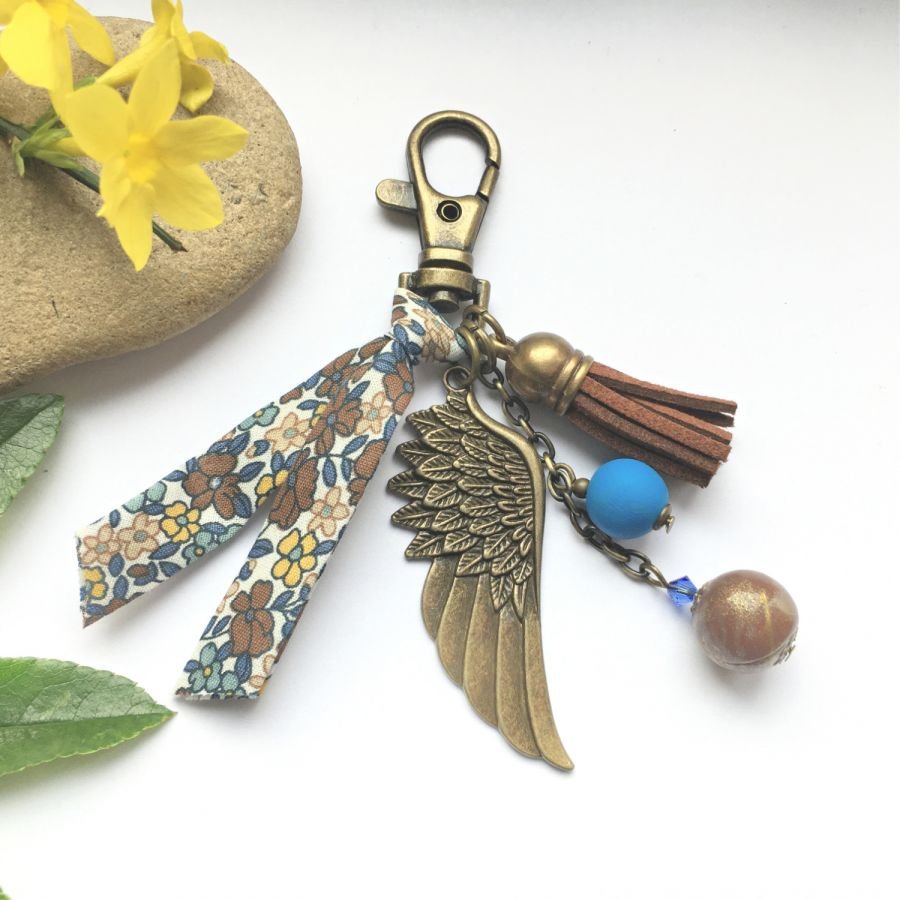 Porta-chaves ou jóia de bolsa com pingente de asa de anjo bronze de cor castanha e azul 
