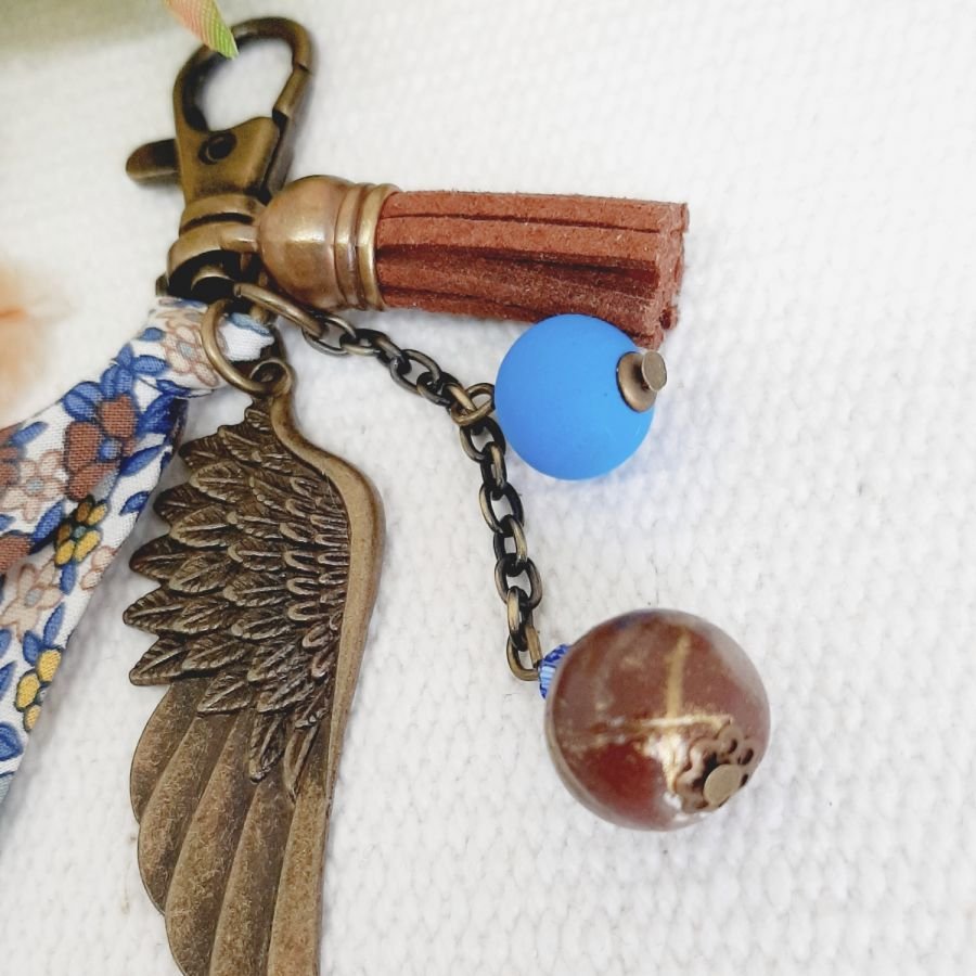 Porta-chaves ou jóia de bolsa com pingente de asa de anjo bronze de cor castanha e azul 