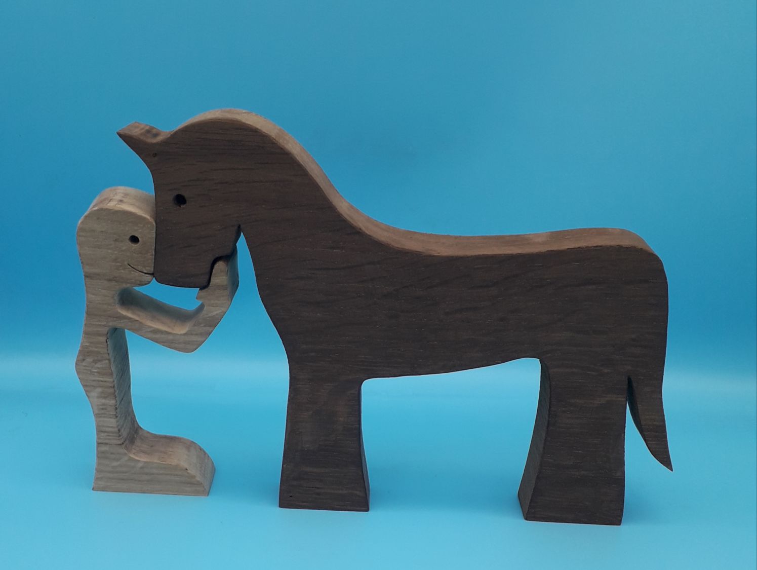 O homem e o seu cavalo estatueta de madeira