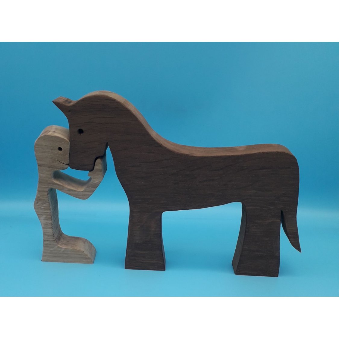 O homem e o seu cavalo estatueta de madeira