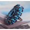 Anel naïade bordado com uma resina azul turquesa e cabochon de cristal, um belo jogo de luz.