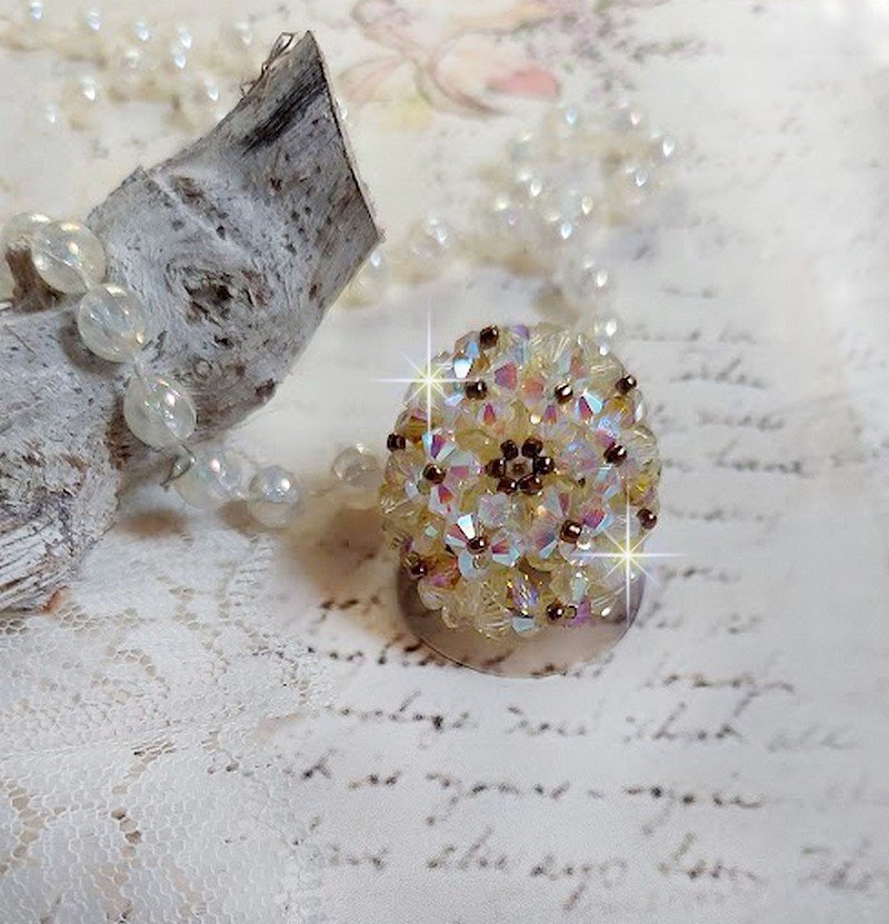 Anel Aurora com facetas e topos giratórios em cristal Swarovski