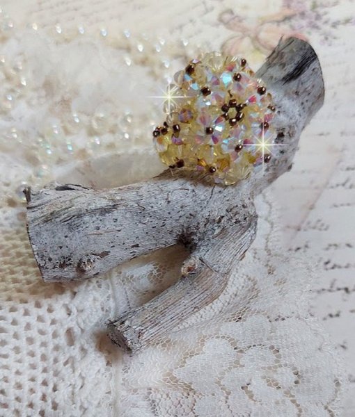 Anel Aurora com facetas e topos girat&oacute;rios em cristal Swarovski