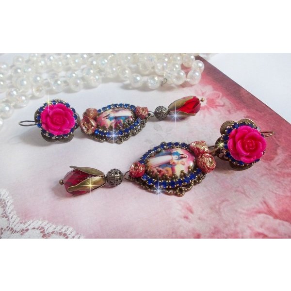 BO Maria e Jesus criados com cabochons de resina, pêras vermelhas facetadas e vários acessórios