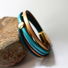 Pulseira de punho em pele azul e dourada para senhora
