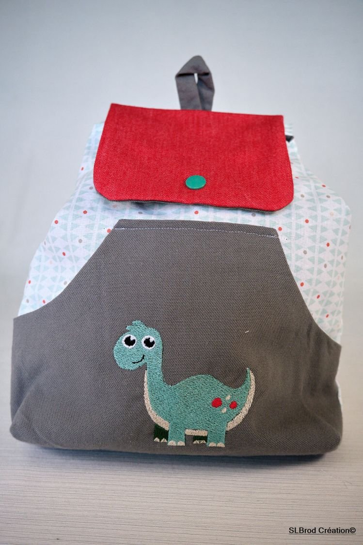 Mochila de dinossauro bordada para personalizar