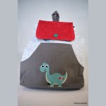 Mochila de dinossauro bordada para personalizar
